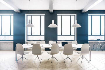 Minimalistic loft office interior with laptops