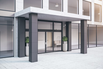Entrance of modern office building with plants