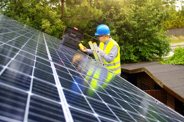 Solar panels installation on the house roof - photovoltaic business