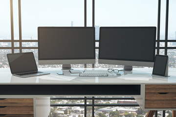 Modern designer desktop with two black computer screen