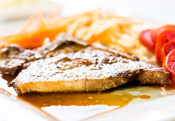Fried pork steak in plate  , in door  Chiangmai  Thailand