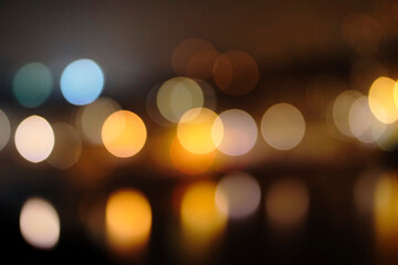 Fototapeta premium Christmas bokeh light background. Circular reflection of city light and blurred background in the night. 