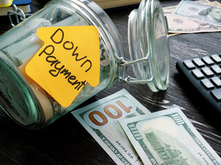 Jar and cash for mortgage with sign down payment.