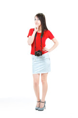 Difficult choice. A beautiful young woman in a red blouse and white skirt, thinking about photography education, isolated on a white background.