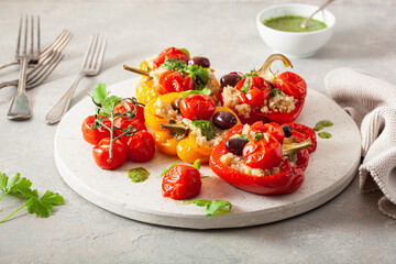 stuffed bell peppers with quinoa tomatoes olives and herb sauce chimichurri