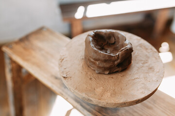 A product made of clay on a Potter's wheel. Pottery store with items. Preparation of clay.