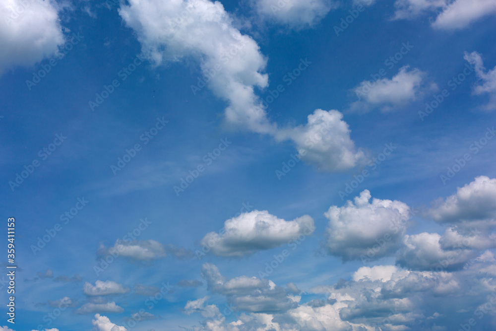 Wall mural White clouds on blue sky background.