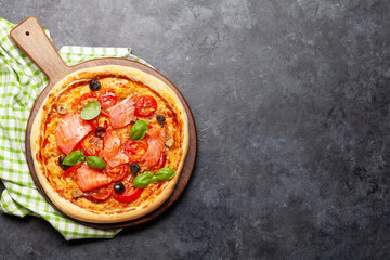 Tasty homemade seafood pizza with salmon