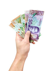 Male hand holding New Zealand banknotes on white background