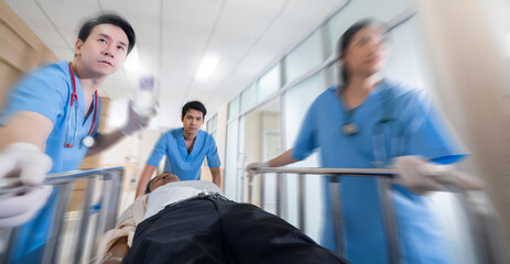Front view of doctors running to the operating room,Doctor wheeling patient Emergency service hospital background