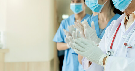 closeup hand applaud from doctor and nurse support,Clapping medical workers blur hospital background