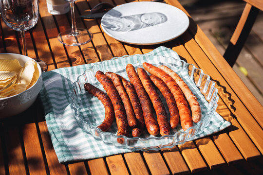 Pork chipolata. Close-up view of fried sausages. Meat dish