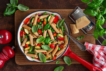 whole grain penne pasta with grilled vegetables ( zucchini, peas, bell pepper ant tomato) and...