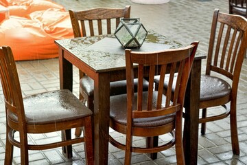 Summer rain. Wet furniture in a cafe. Clean air, cool.
The weather is changing fast.