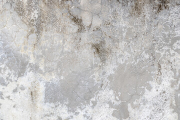 Dirty old concrete wall texture with cracks and stains.