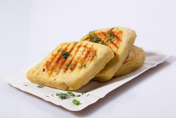 Fried potato pies. Patties with dill. Cheap recipe for homemade fried pies on a white background. Easy meal idea.