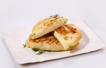 Zrazy with dill on a paper plate on a white background. Easy meal idea.
