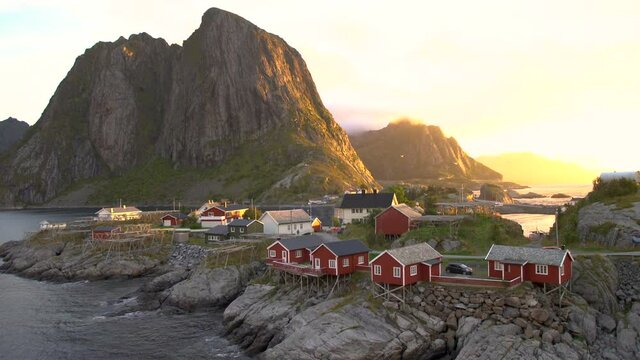Red wooden huts, known as Rorbu, in the village of Reine on the Hamnoy island, Lofoten Islands, Norway. Rorbu is a Norwegian traditional house used by fishermen, today most are used by tourists.