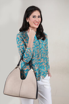 elegant ladies carrying women's handbags and shopping bags