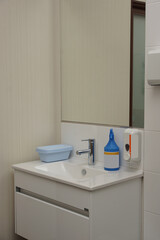 Fototapeta na wymiar Sink for washing hands and disinfectants in a medical office