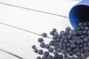 Blueberry on wooden table background, bowl of blueberries. .Antioxidants, detox diet, organic fruits. Berries