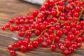 currants on wooden table background, spilled from a spice jar. .Antioxidants, detox diet, organic fruits. Berries