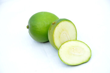 sliced green ripe mango isolated on white background