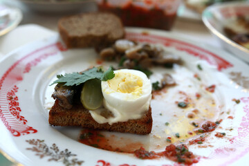Crouton with egg and pickle