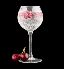 Cherry in a wineglase isolated on white background with clipping path