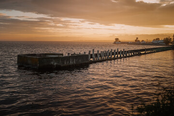 Beautiful bright sunset on the pier