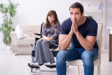 Disabled wife and young husband at home