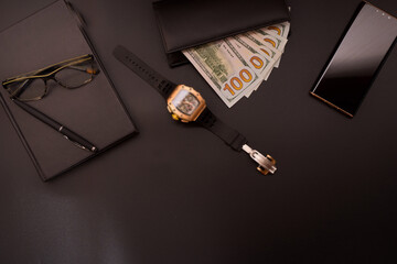 Man accesories on black background. Watches, Wallet, money, glasses, pen, notebook, Success concept background. 