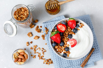 Homemade oatmeal granola bowl with greek yogurt and berries