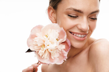 Image of beautiful young happy shirtless woman holding peony flower