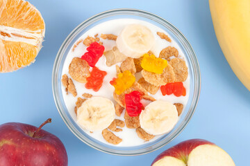 Healthy eating breakfast bowl of low calories muesli with fruits and milk