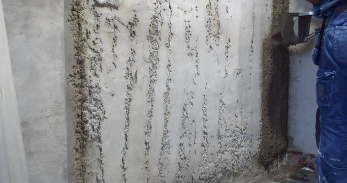 Spraying the walls with plaster, renovation work, plaster hopper bucket, 4k