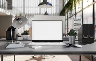 Laptop blank screen in an industrial office interior