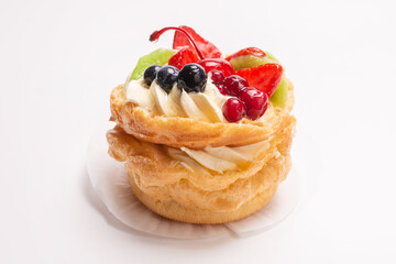 Home made cake with cream and fruits isolated.