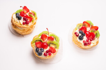 Home made cake with cream and fruits isolated.