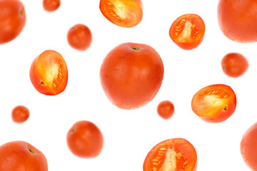 Tomatoes falling on white background
