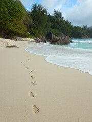 footprints at the beach Anse Intendance, Mahe Island, Seychelles, October