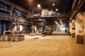 Daytime general view of the copper smelting shop at a metallurgical plant. Casting copper into bowls for further cooling