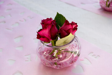 pink roses in a glass vase wedding decoration