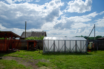 Small beautiful garden in private house, Russia, Vologda oblast, 2014. People grow vegetables. 