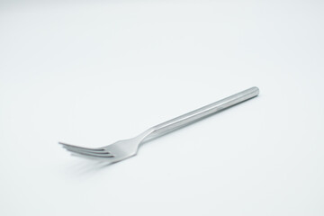 stainless fork in a white background