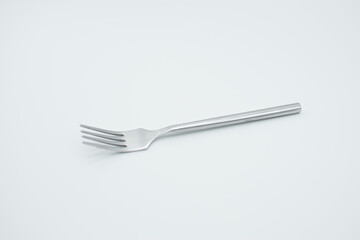 stainless fork in a white background