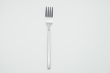 stainless fork in a white background