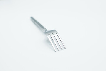 stainless fork in a white background