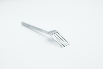 stainless fork in a white background