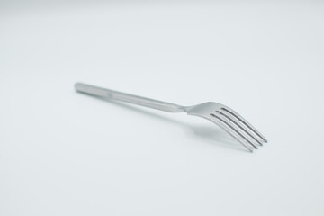 stainless fork in a white background